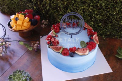 happy smiles logo birthday cake in dubai