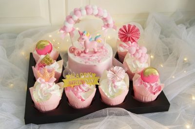 Unicorn theme cake with cupcakes