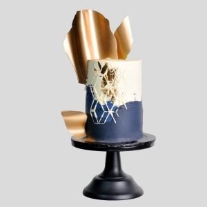 Nautical Elegance with Gilded Crest Cake
